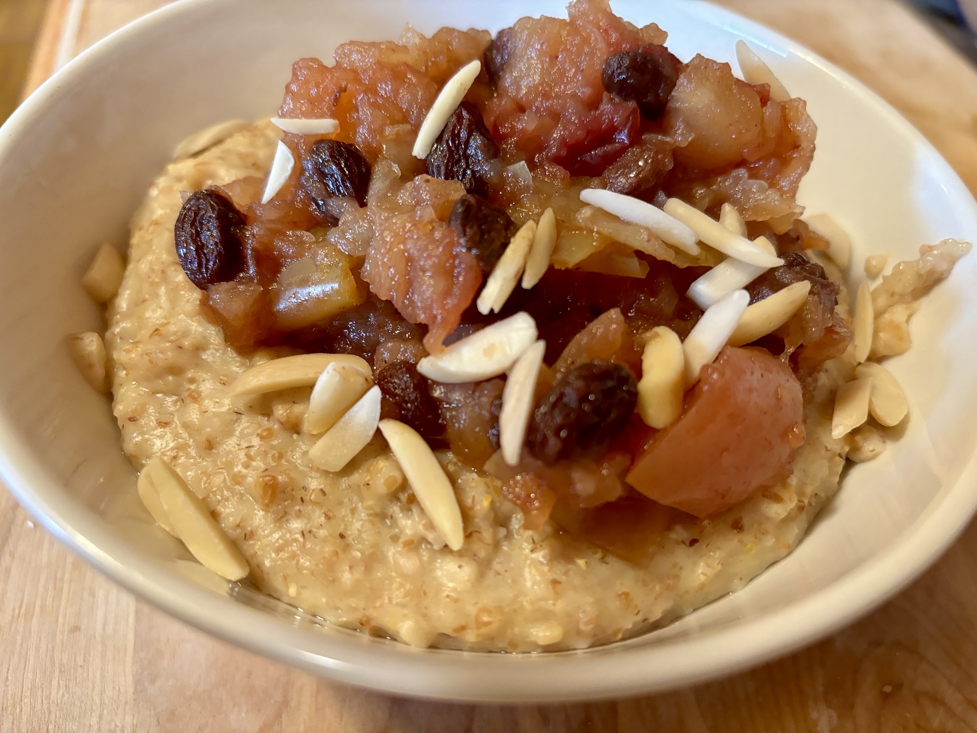 Oat Millet Porridge with Homemade Apple Raisin Sauce and Slivered Almonds Oat Millet Porridge with Homemade Apple Raisin Sauce and Slivered Almonds