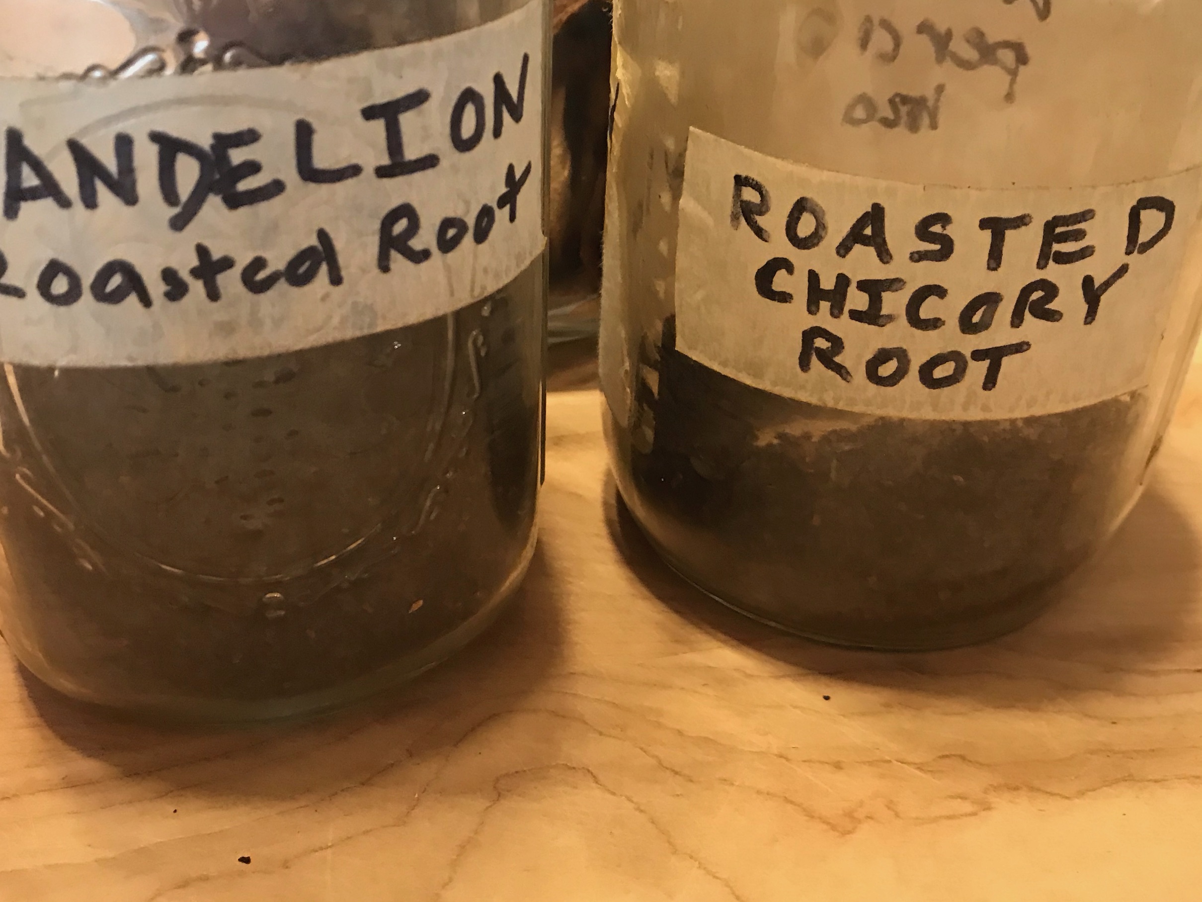 Roasted granulated dandelion root & chicory root in jars
