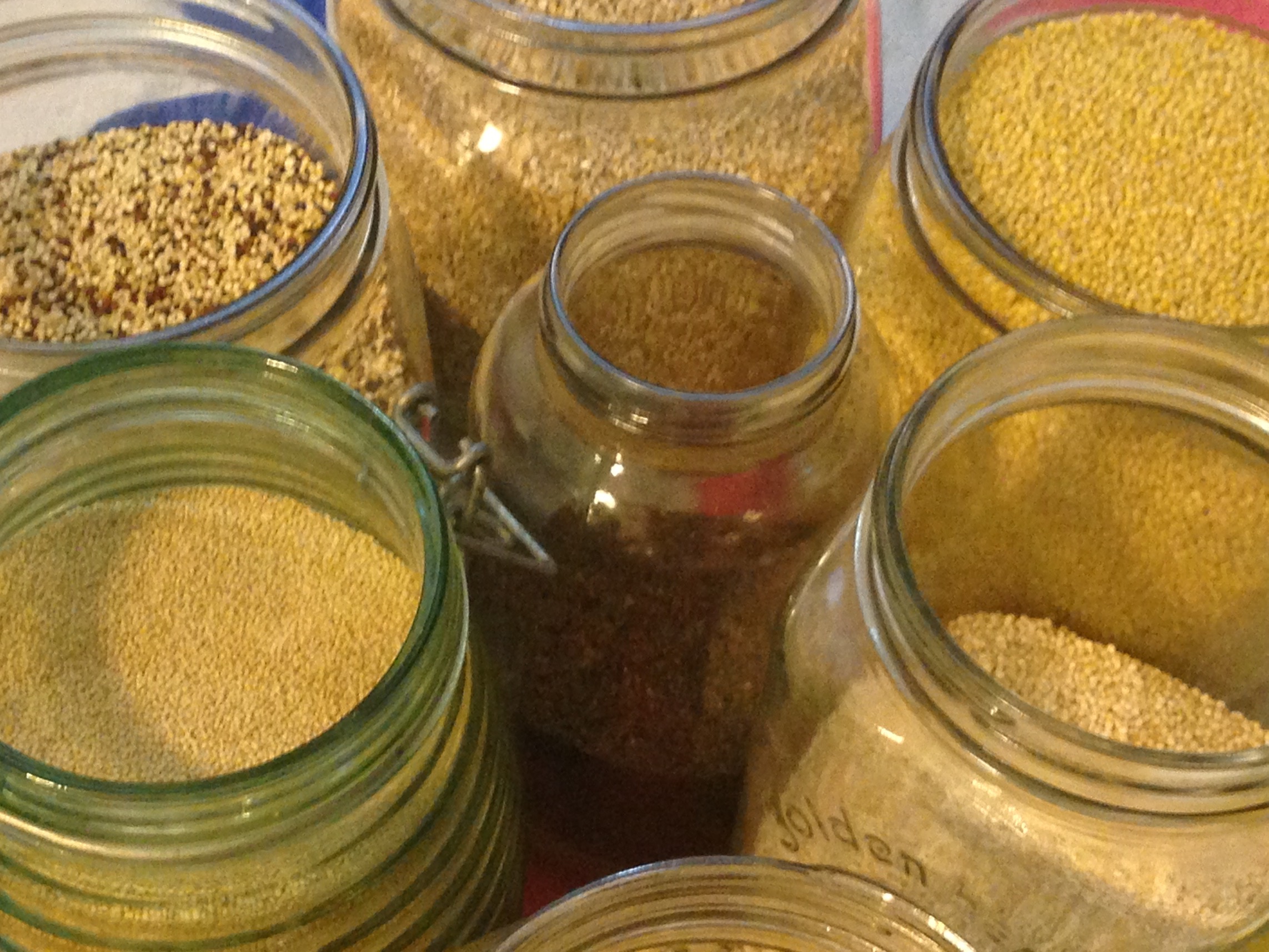 Variety of whole grains in jars Variety of whole grains in jars