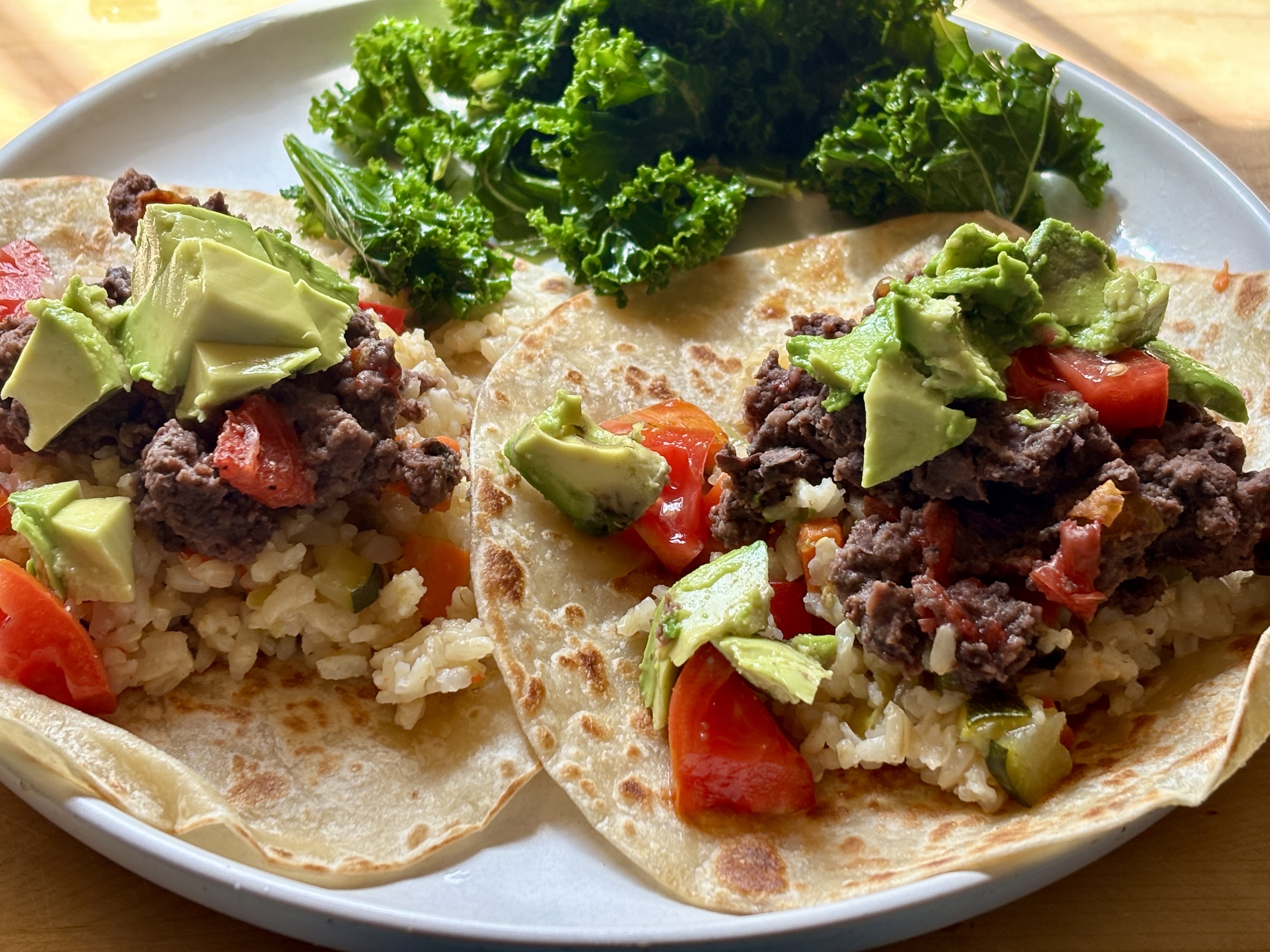 Meal of Refried Beans On Whole Grain Tortillas with Kale and Avocado Meal of Refried Beans On Whole Grain Tortillas with Kale and Avocado