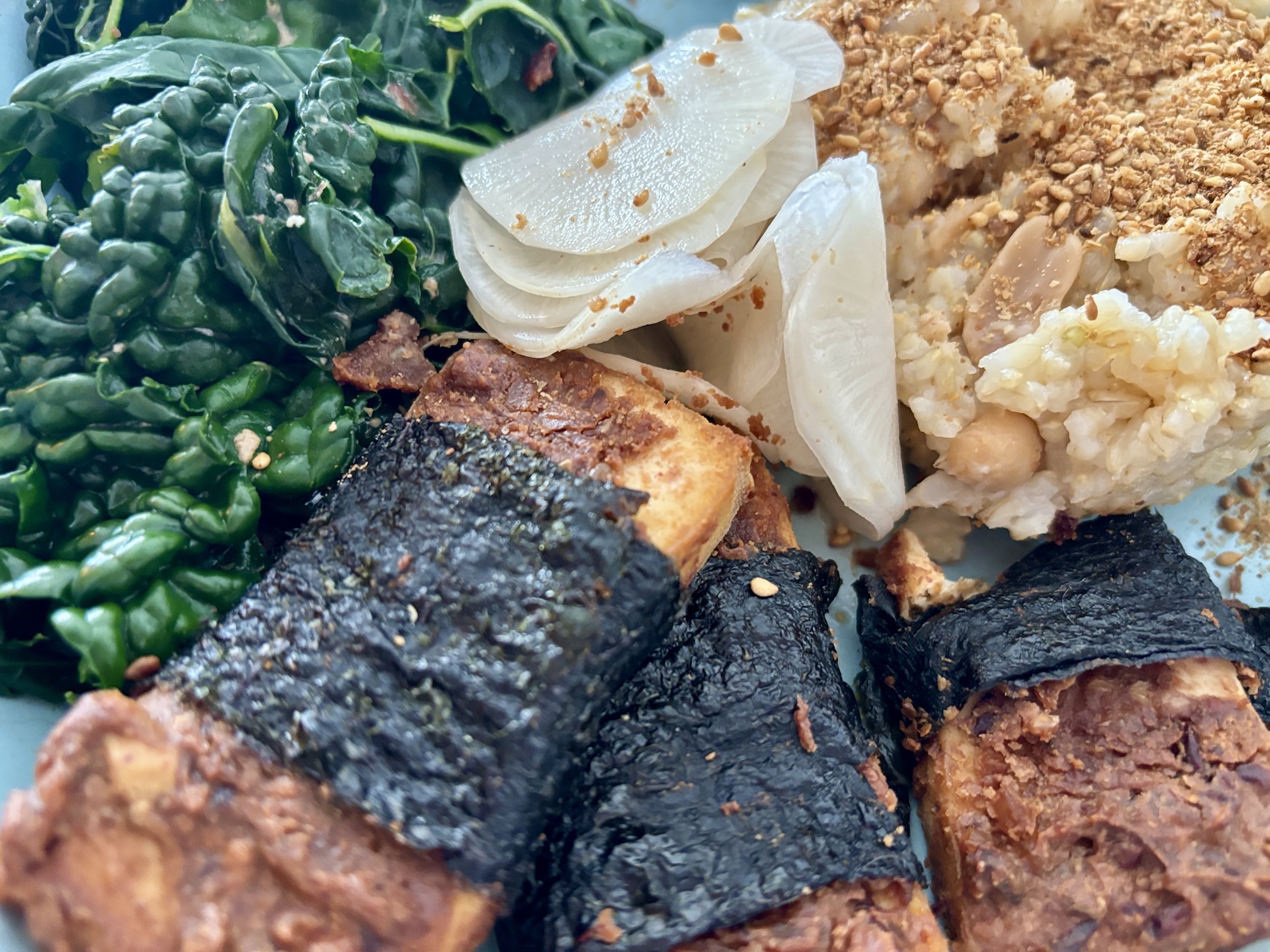 Miso Peanut Butter Baked Tofu Wrapped in Nori with Brown Rice, Greens & Daikon Miso Peanut Butter Baked Tofu Wrapped in Nori with Brown Rice, Greens & Daikon