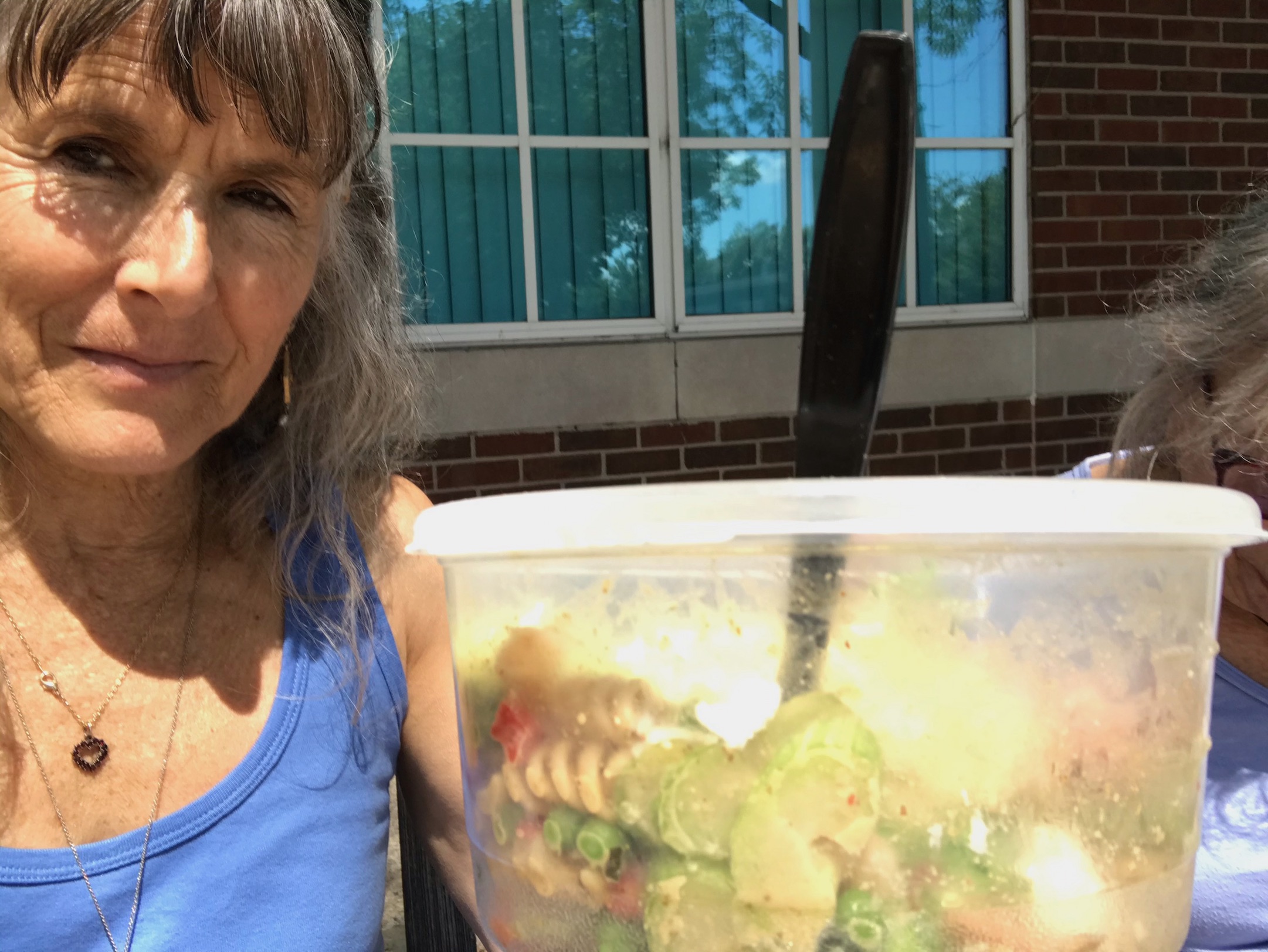 Mom & I having pasta salad to-go while sitting outdoors