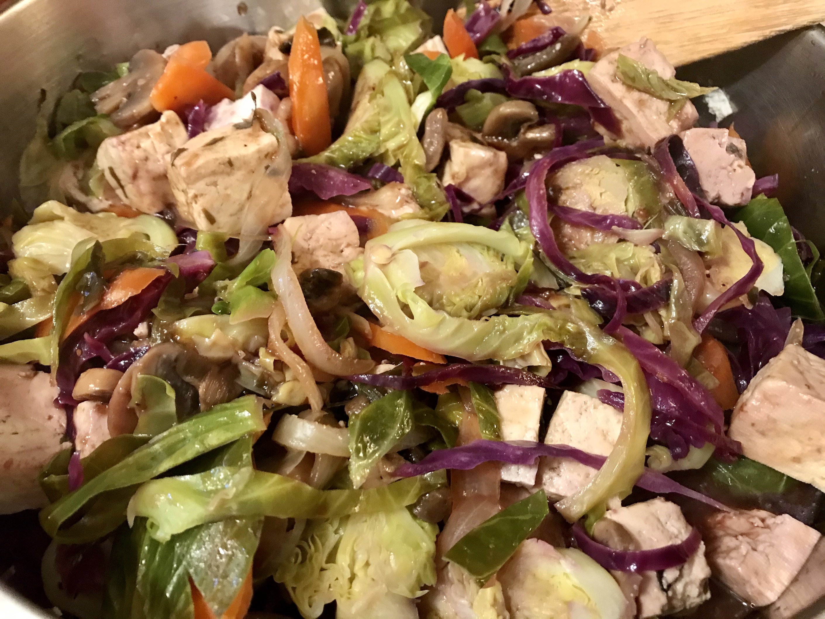 Tofu Braised in Plum Sauce with Brussels Sprouts Simmering in the pan