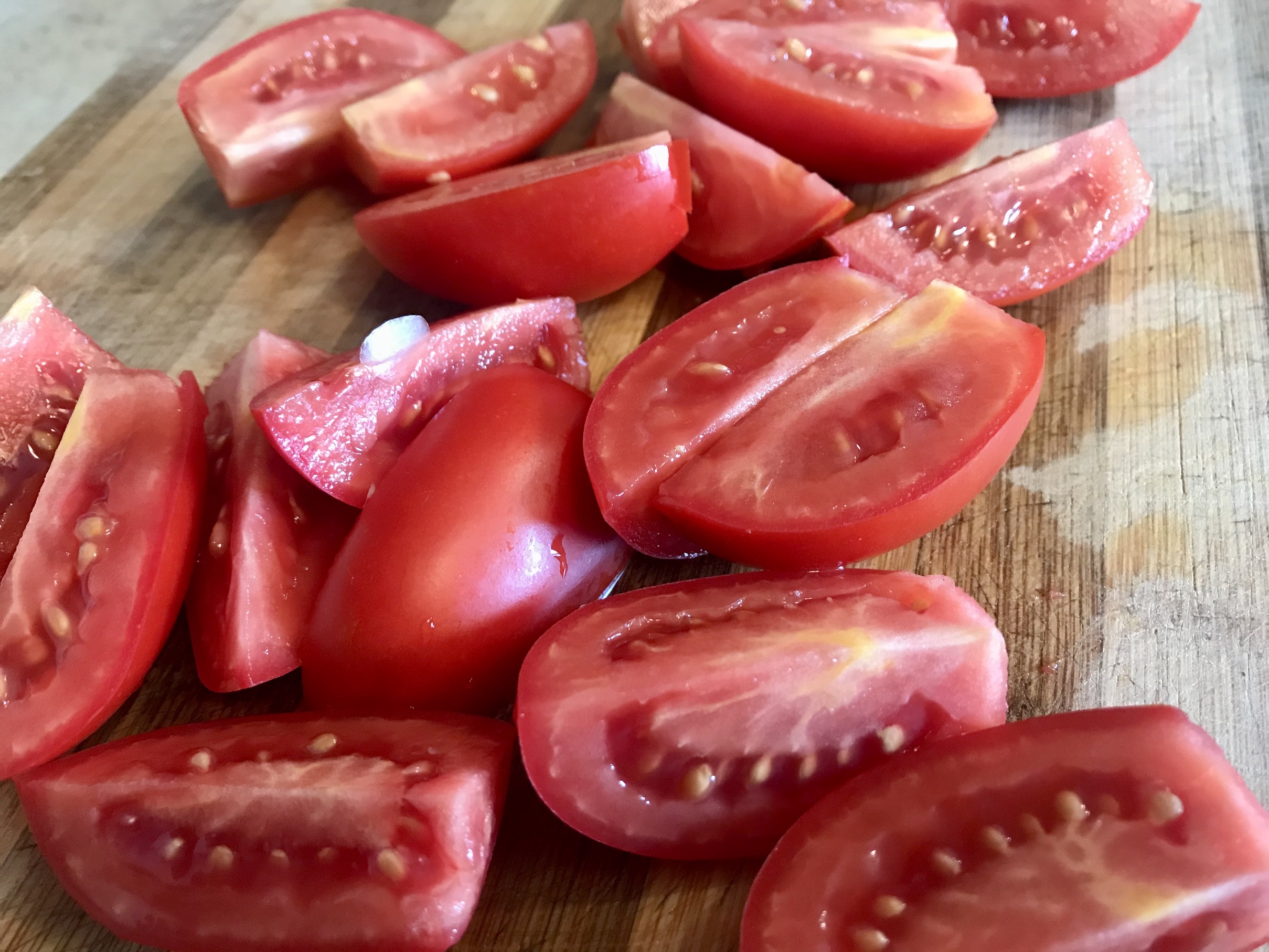 Tomatoes from garden sliced in wedges Tomatoes from garden sliced in wedges