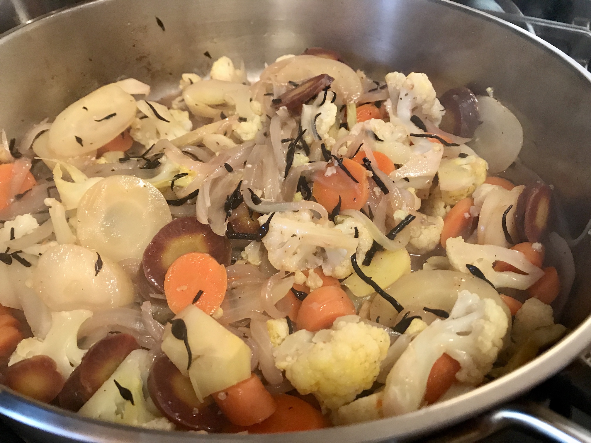 Lemony Colorful Carrots and Cauliflower with Hijiki cooking in large stainless steel pan Lemony Colorful Carrots and Cauliflower with Hijiki cooking in large stainless steel pan